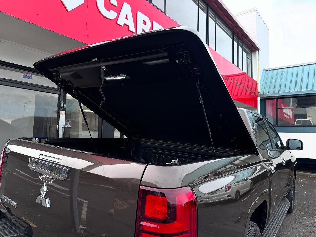 Sport Lid SV open on a brown Triton showing the lined underside
